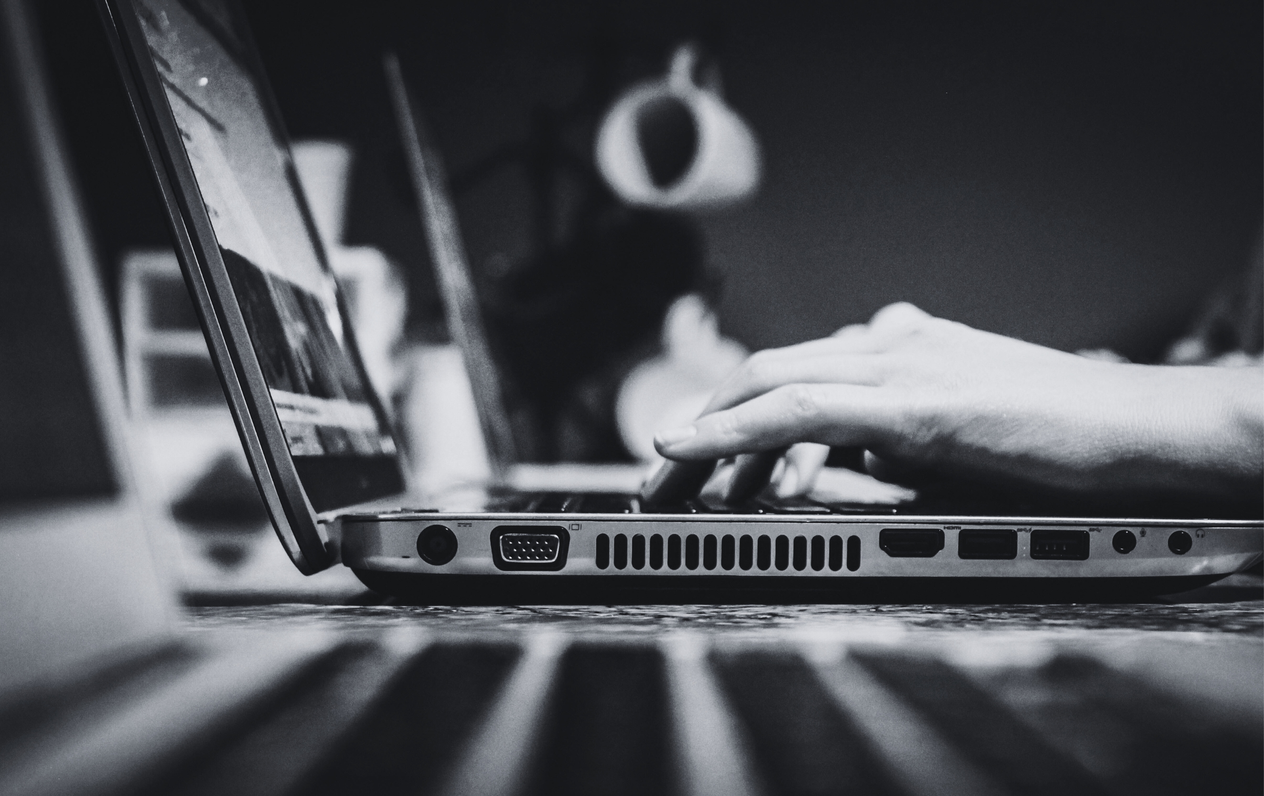 Girl typing on a laptop about writing effective call-to-actions